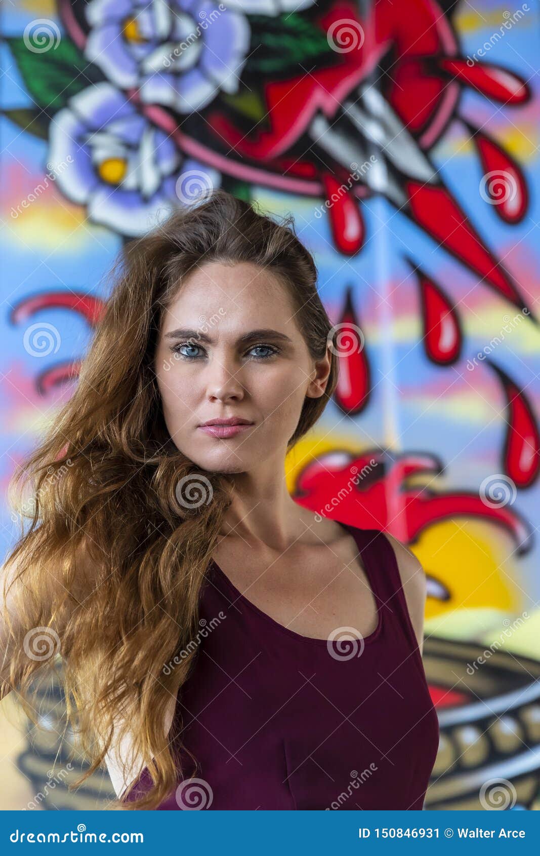 Lovely Brunette Model Posing Outdoors Against Graffiti Stock Image