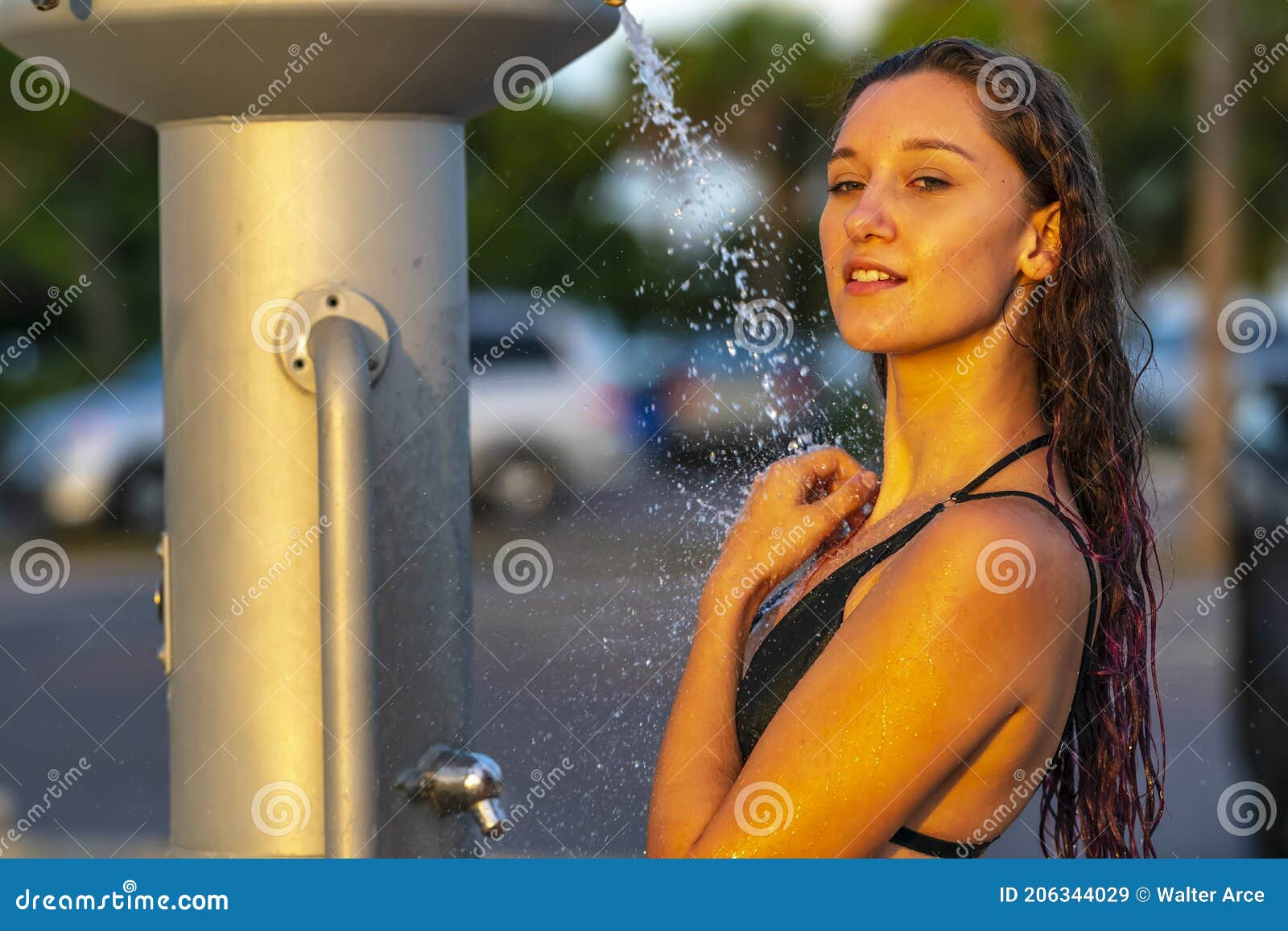 A Lovely Brunette Model Showers Outdoors After Swimming In The Ocean Stock Image Image Of