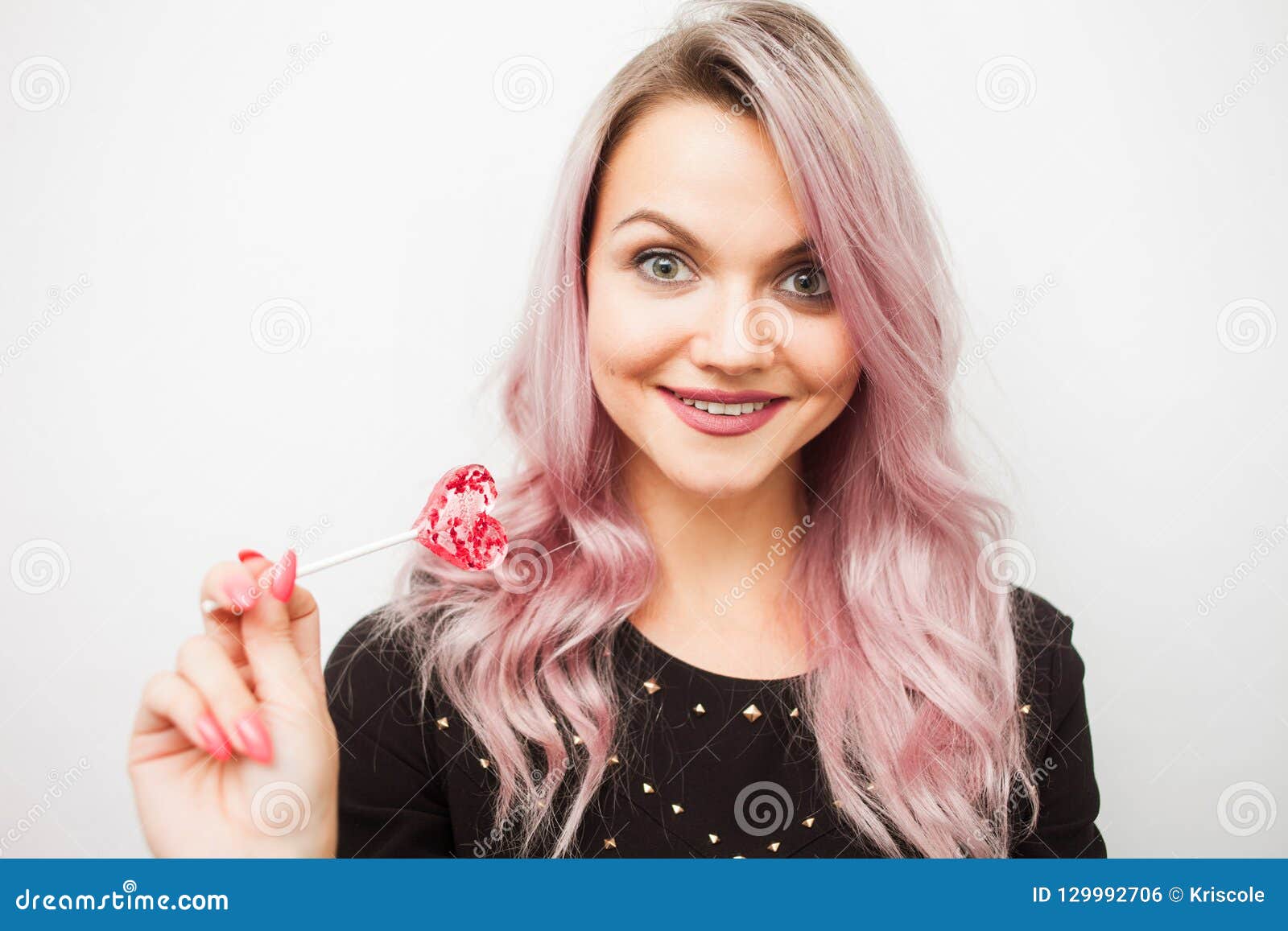 Lovely Charming Girl With A Lollipop In The Form Of Heart. Portrait Of A Young Woman With Pink ...