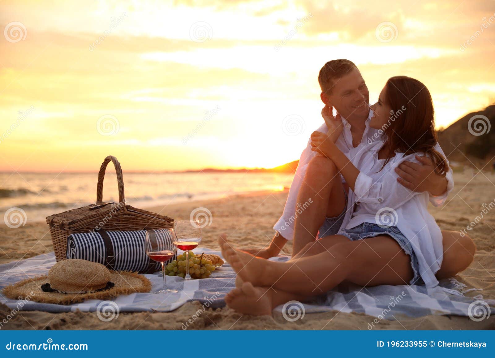 Lovely Couple Having Romantic Picnic On Beach At Sunset Stock Image Image Of Blanket Alcohol