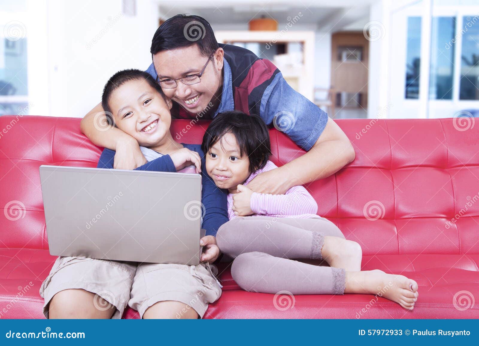 Lovely Kids With Dad Using Laptop On Sofa Stock Image Image Of