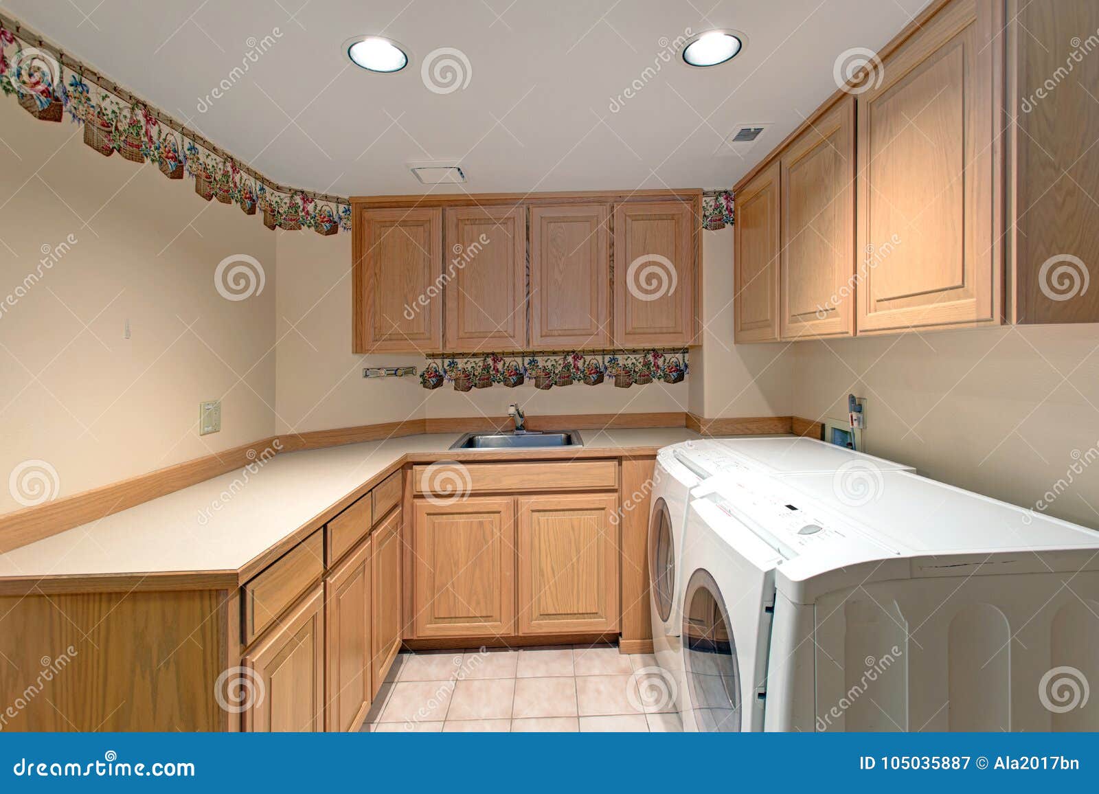 Lovely Laundry Room Interior With Wooden Cabinets Stock Image