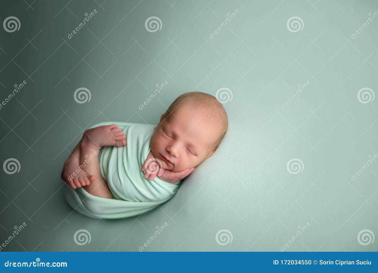 lovely newborn baby boy sleaping confort pose