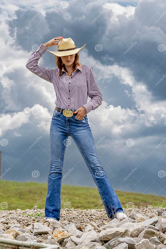 A Lovely Red Headed Country Wetern Model Poses Outdoors in a Country ...