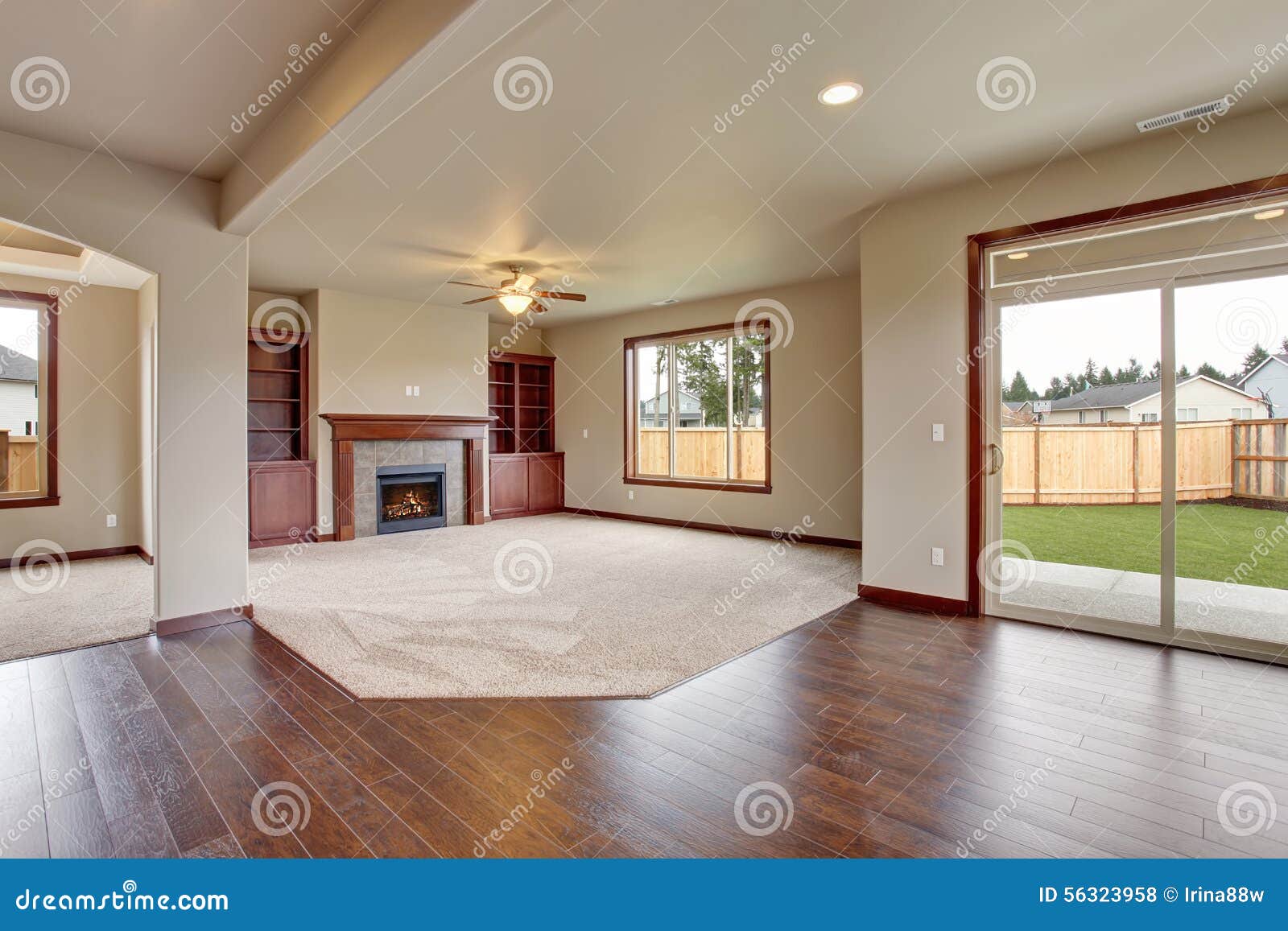 lovely unfurnished living room with carpet.