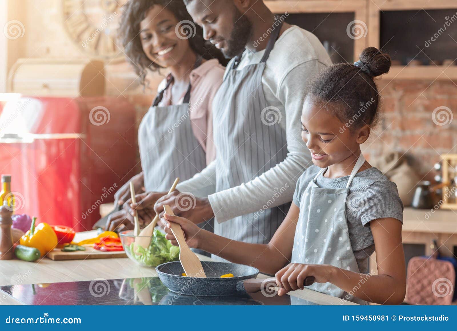 Lovely Vegan Family Making Healthy Dinner Together Stock Image - Image