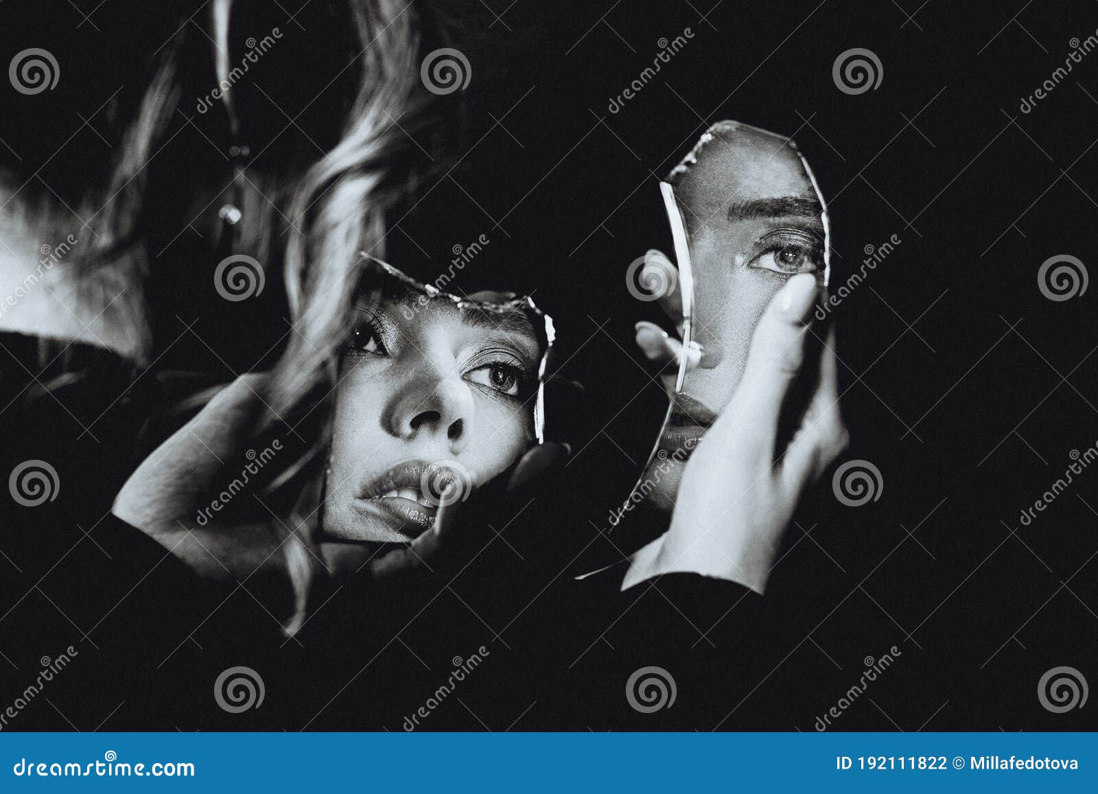 lovely woman looking at broken self-image mirror, black and white retro portrait