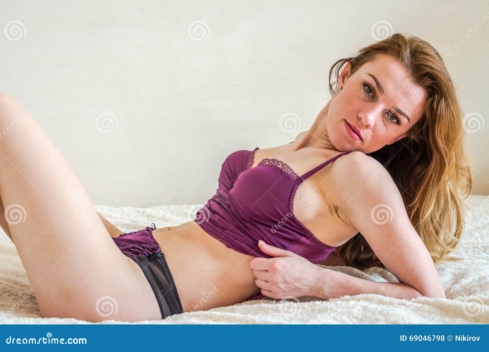 Lovely Young Girl with Long Hair after Sleeping, Lying on the White Blanket on the Bed in Erotic Underwear and Lacy Shorts Who Sex Stock Photo image pic