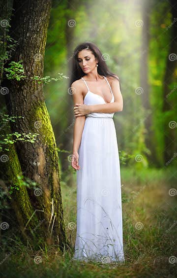 Lovely Young Lady Wearing an Elegant Long White Dress Enjoying the ...