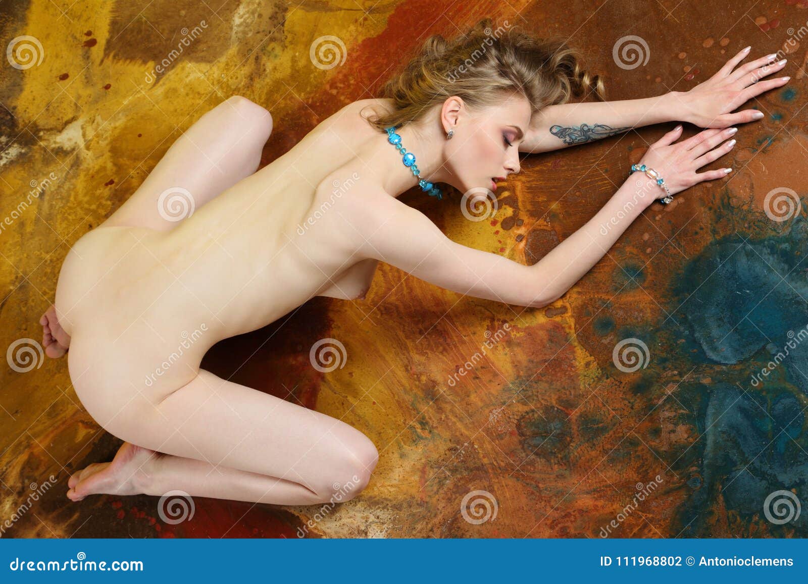 Fully Naked Girl with a Beautiful Nude Body Turned Her Back and Booty Stock Photo