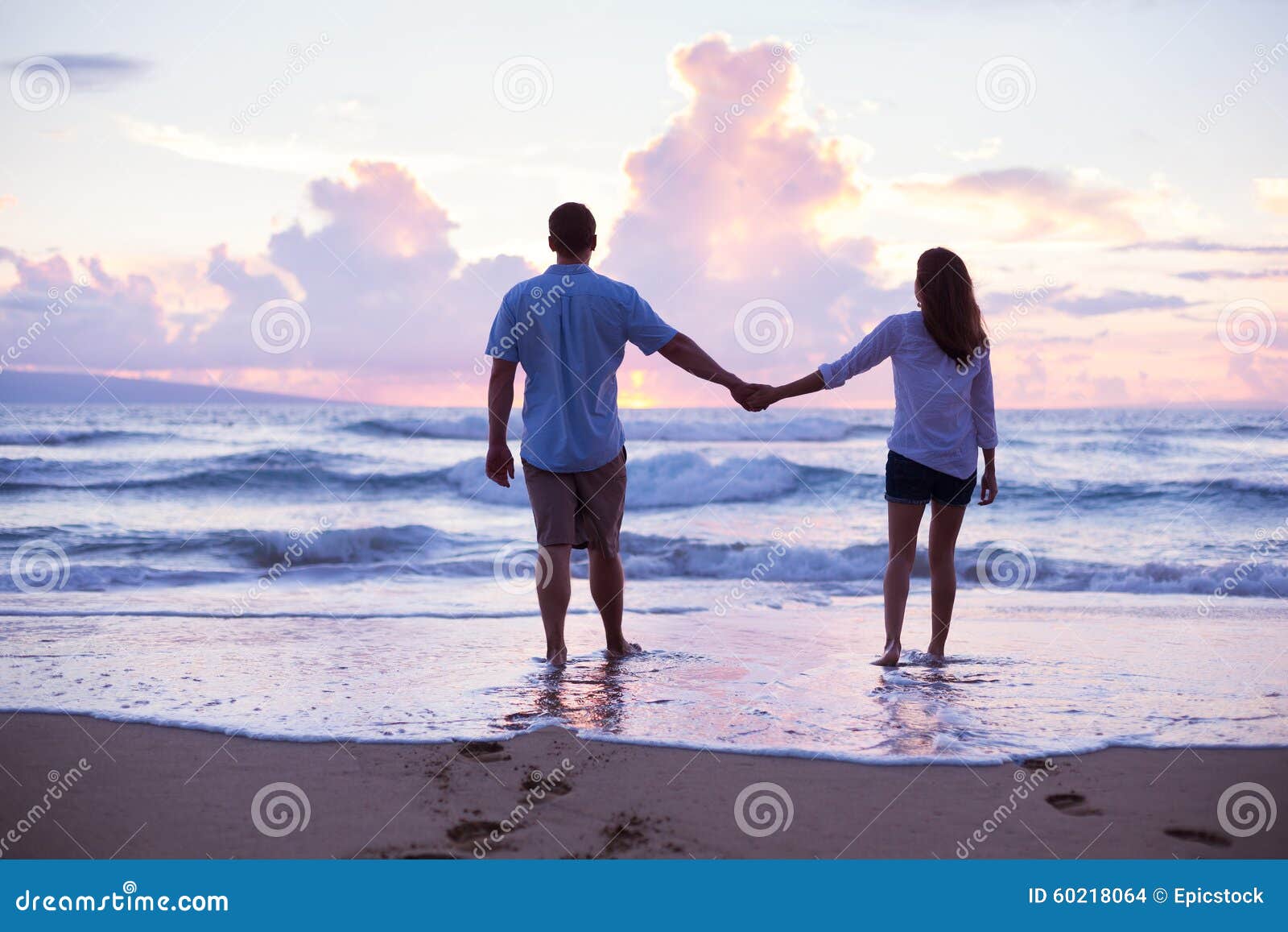 Lovers Walking on the Beach at Sunset on Vacation Stock Photo Image