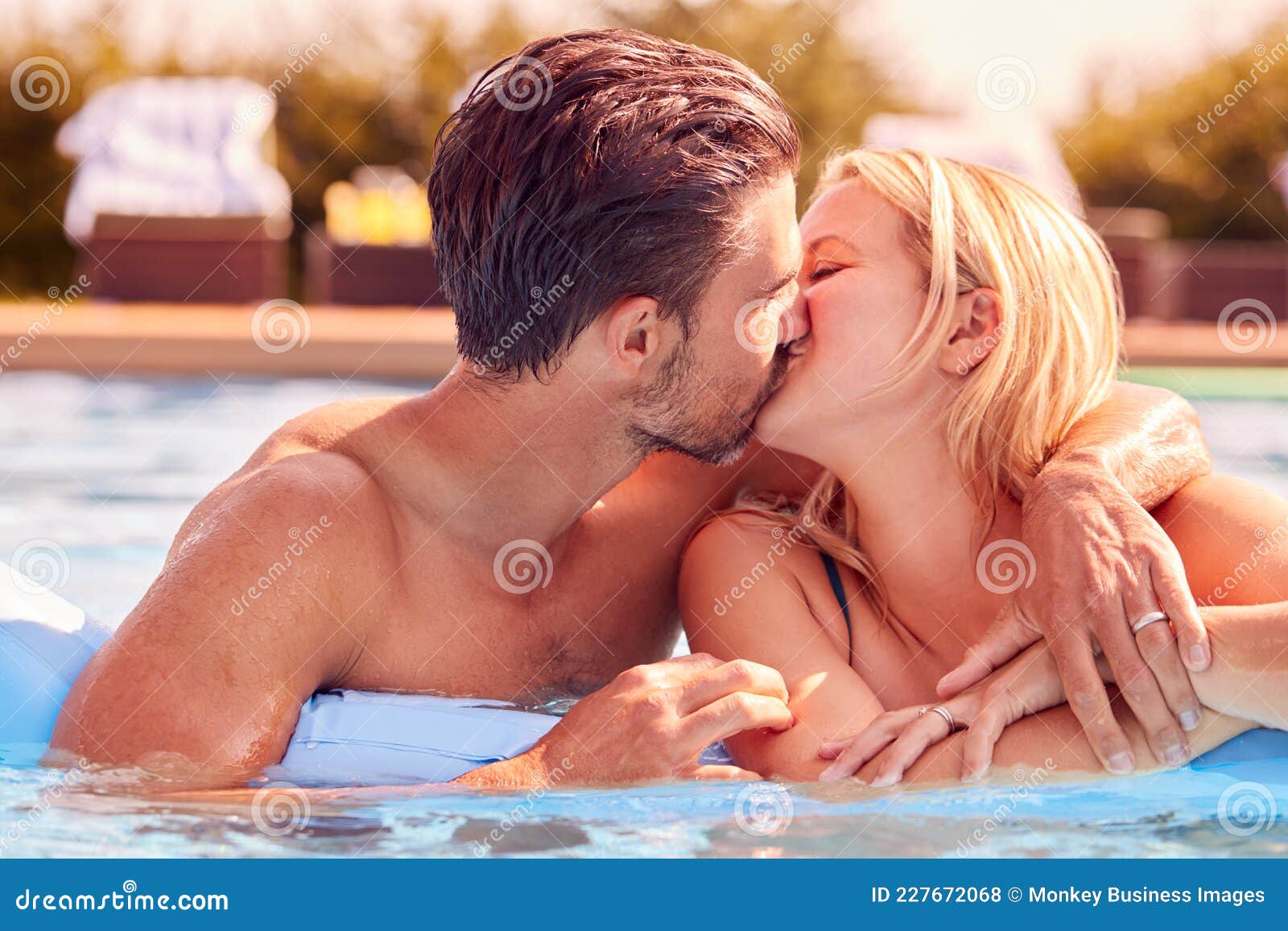 Girls Kissing In The Pool