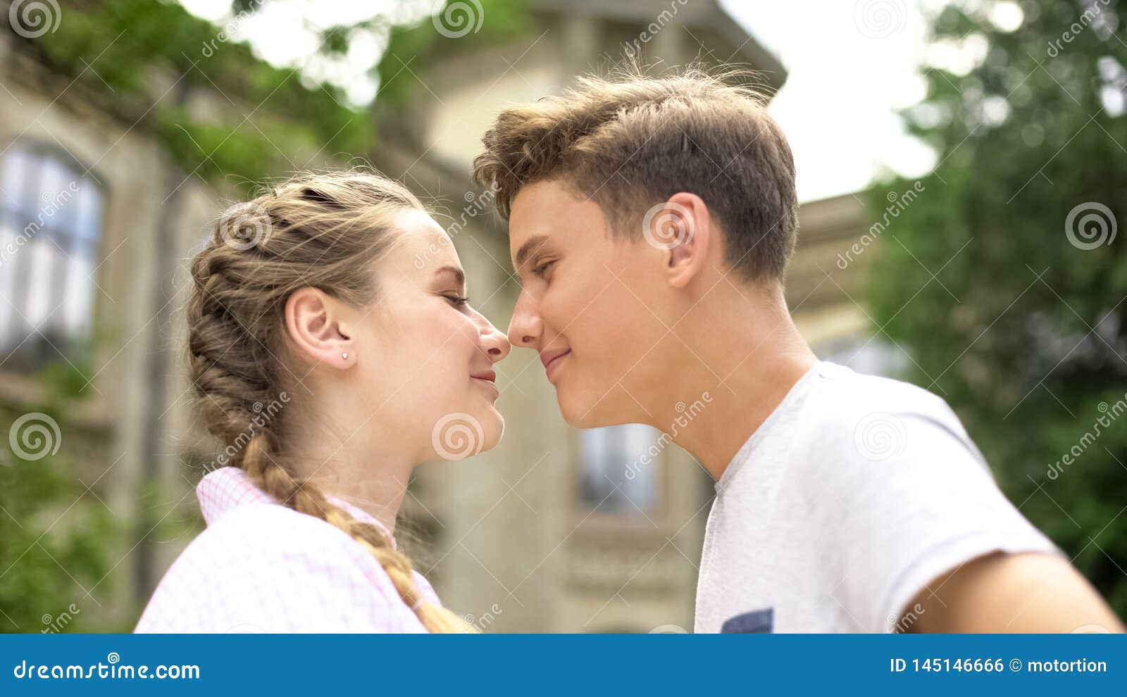 Loving Couple Nuzzling First Love Teens Looking At Each Other