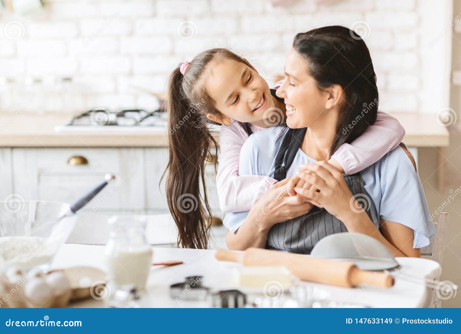 Loving Daughter Hugging Her Mother On Kitchen Stock Image Image Of Concept Infant 147633149 