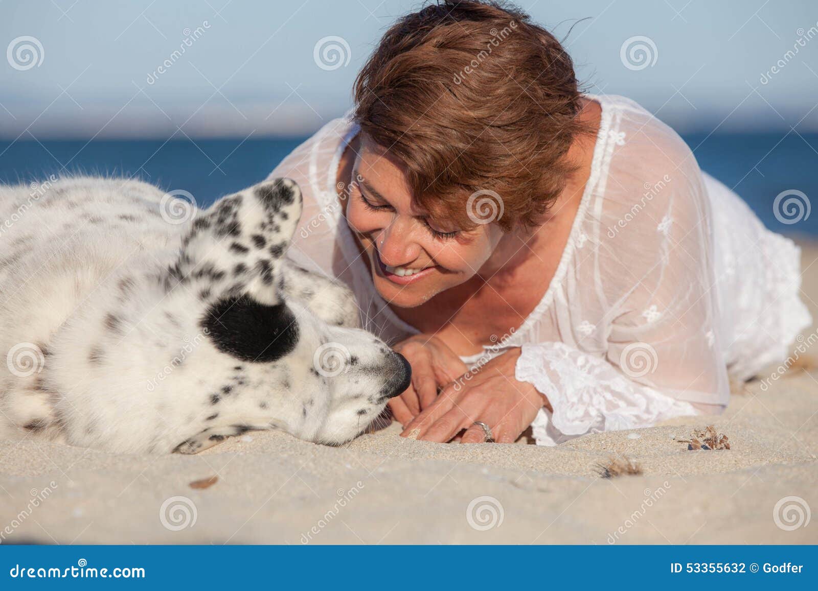 Loving Dog Owner At Beach Stock Photo - Image: 53355632