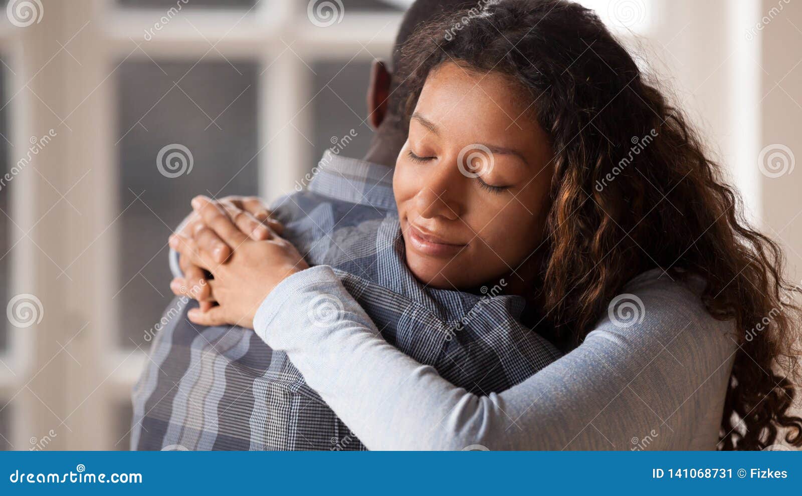 loving girlfriend hug boyfriend happy to reconcile after fight