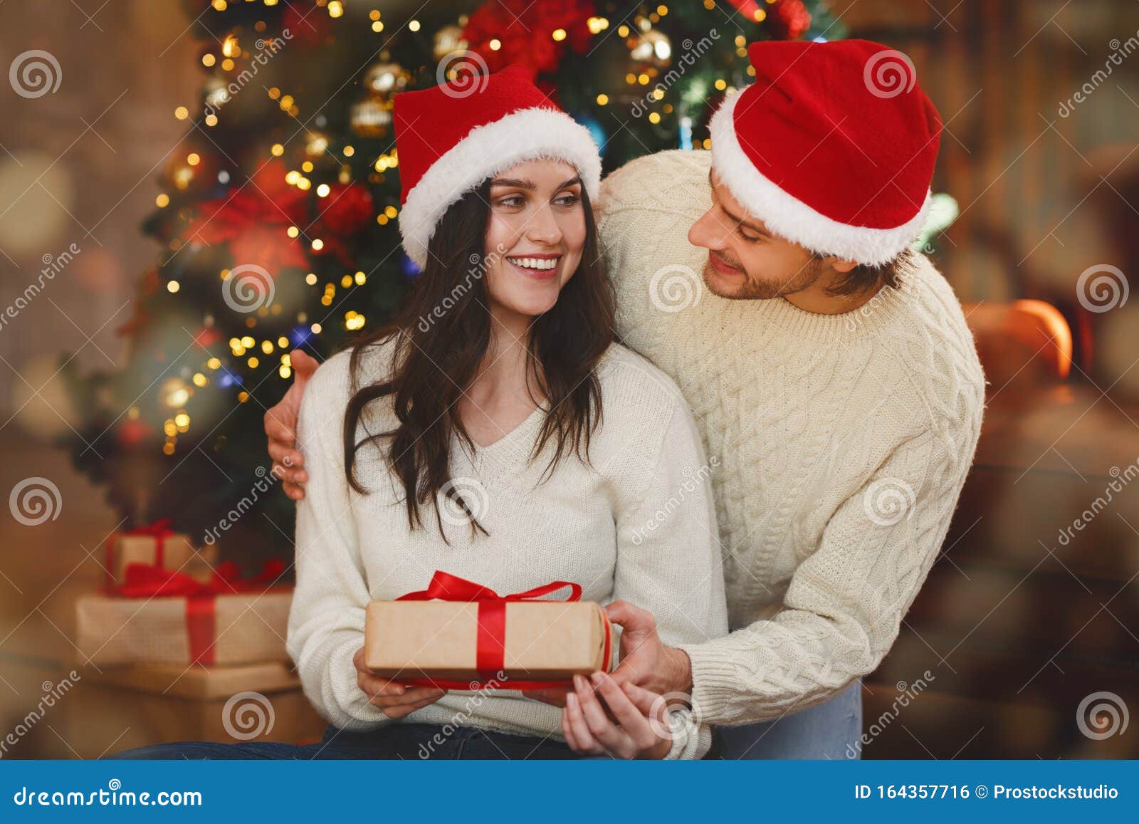 Loving Husband Giving His Wife Christmas Gift Stock Photo - Image of