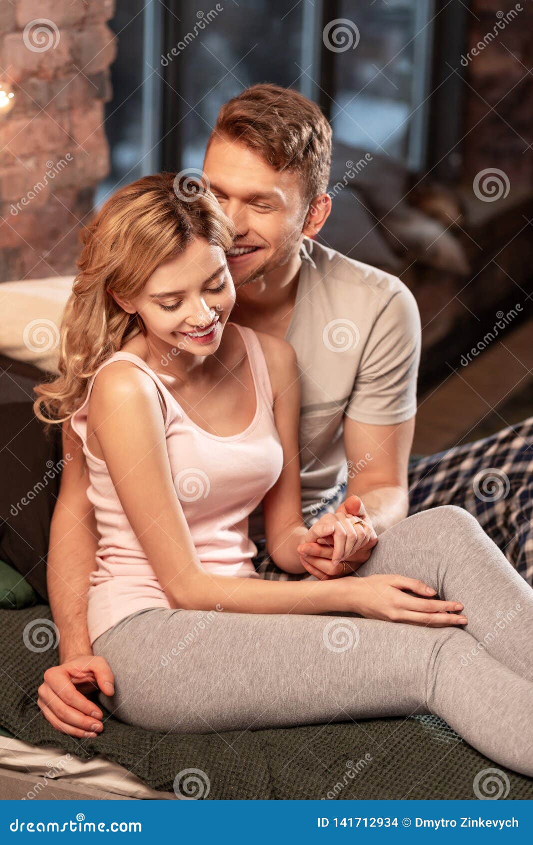 husband in bed with his wife