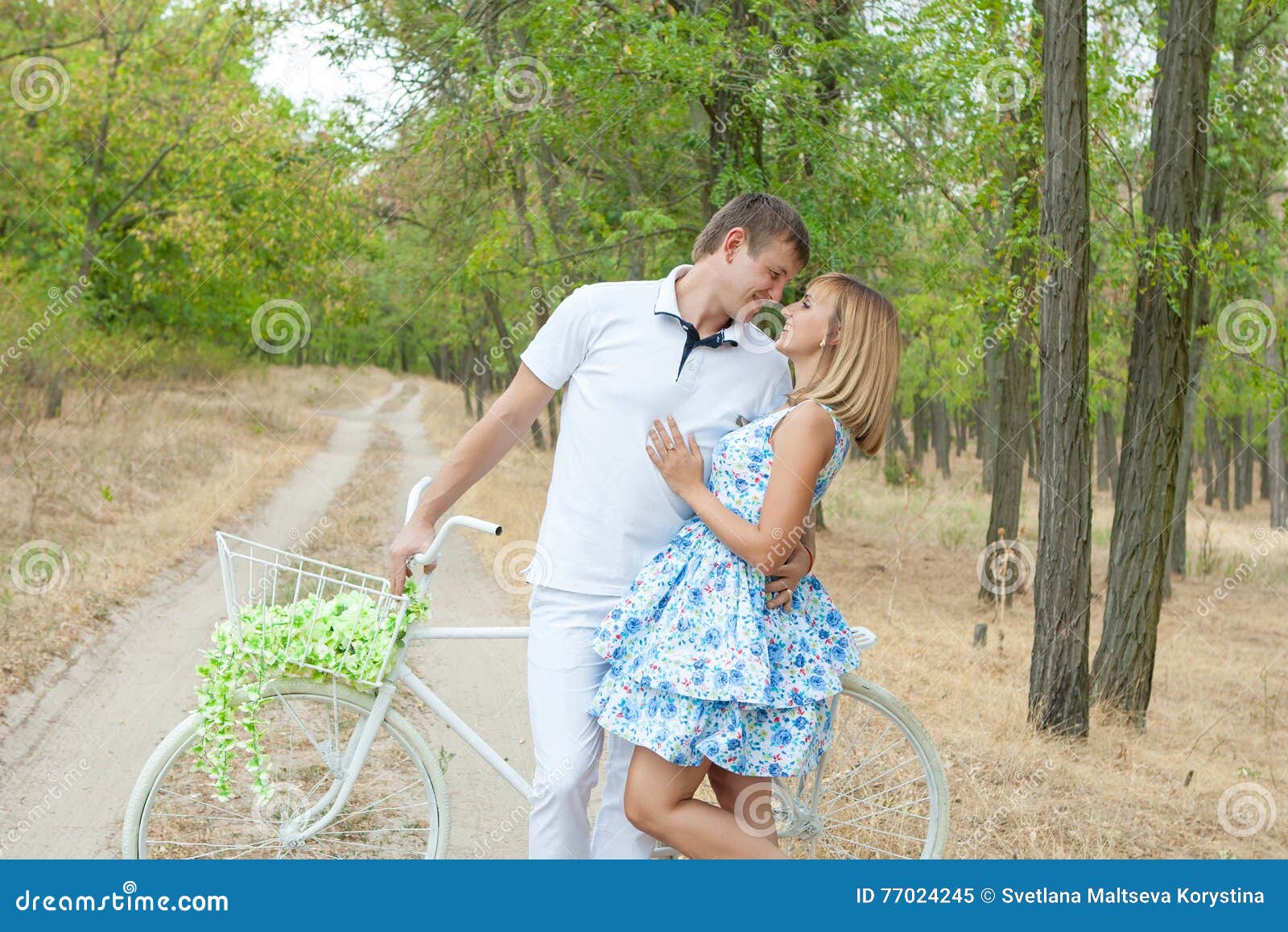 https://thumbs.dreamstime.com/z/loving-man-woman-cheerful-couple-having-fun-summer-vacation-happy-men-husband-wife-bike-young-couple-forest-77024245.jpg