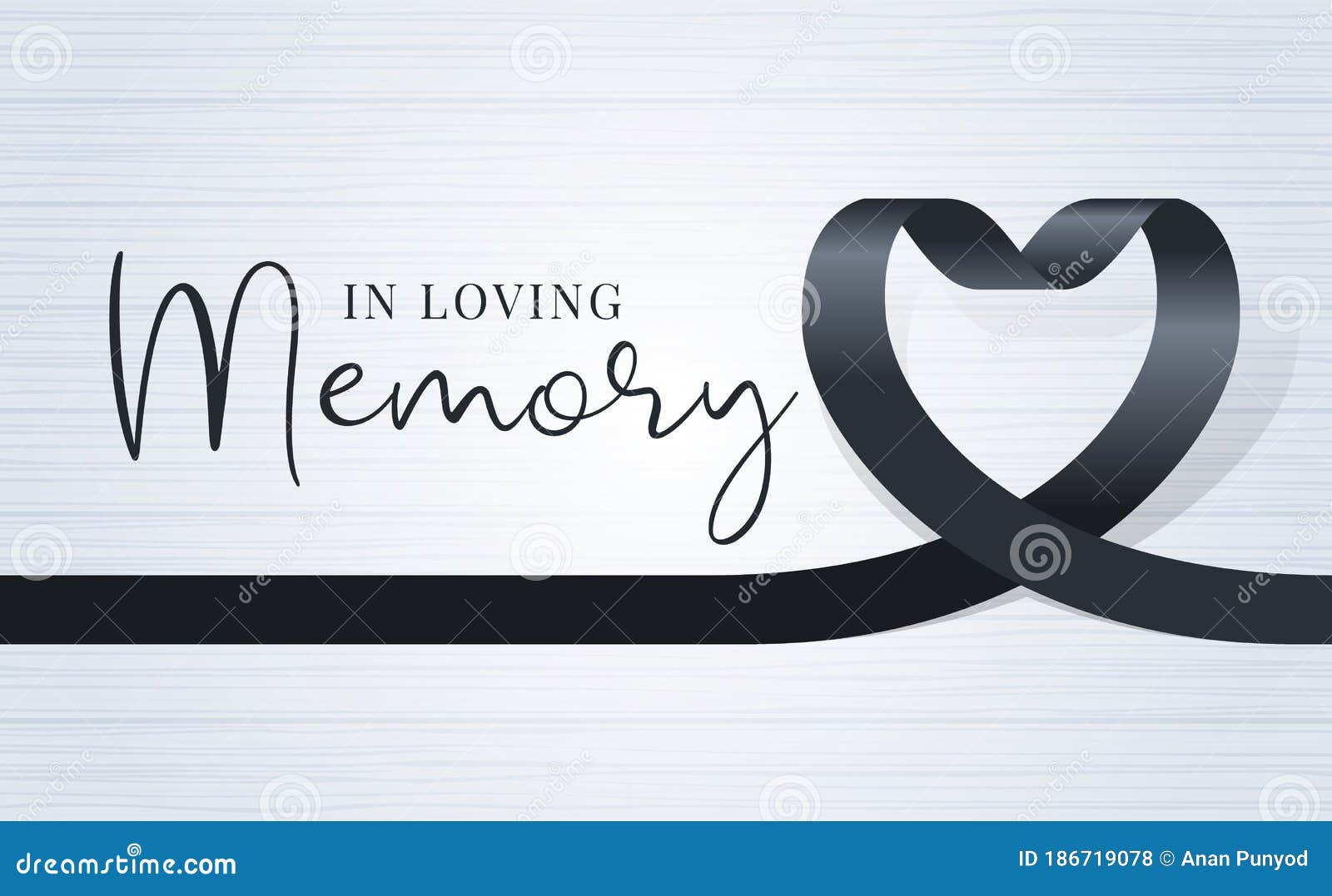 In Loving Memory Text and Black Heart Ribbon Sign on Soft Light Wood