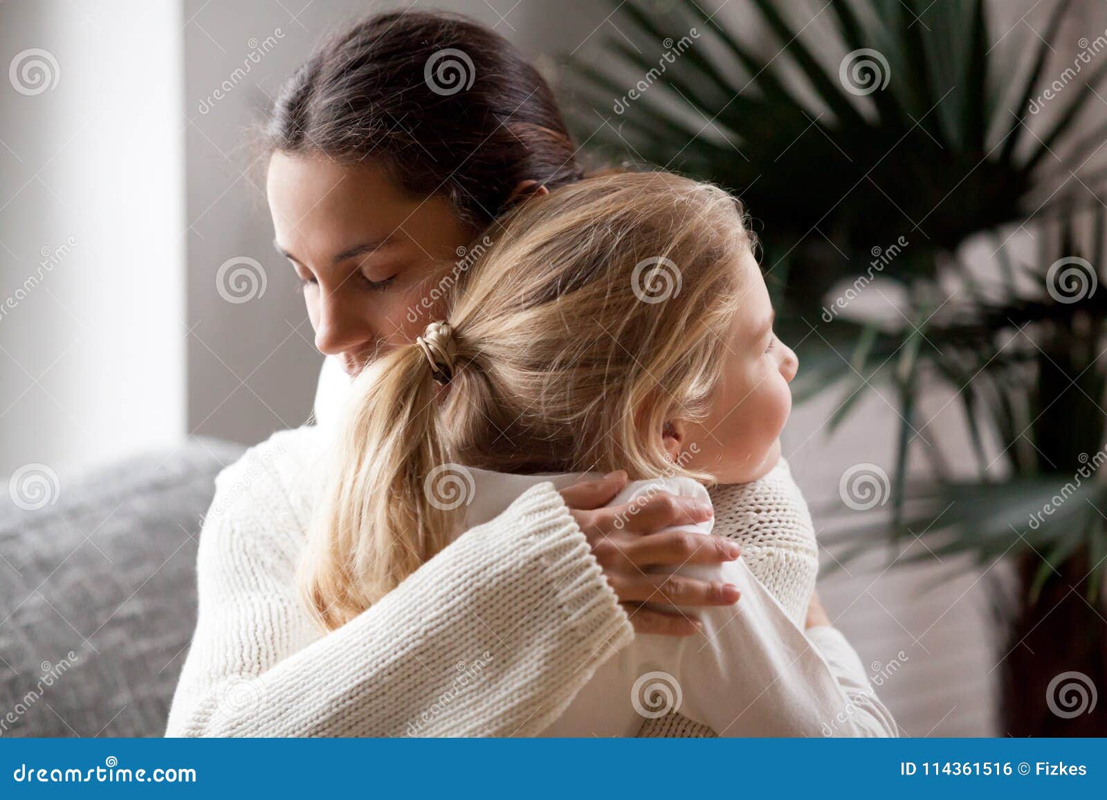 loving mother hugging little girl, moms love and adoption concep