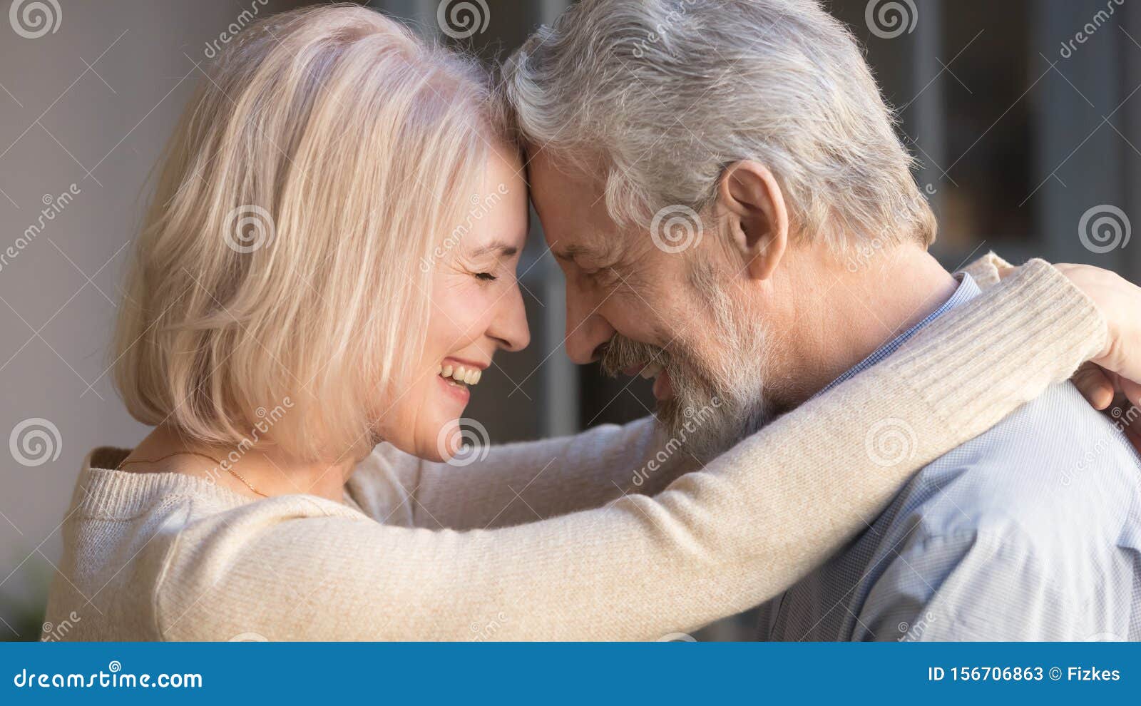 loving old family couple bonding embracing enjoying moment of affection