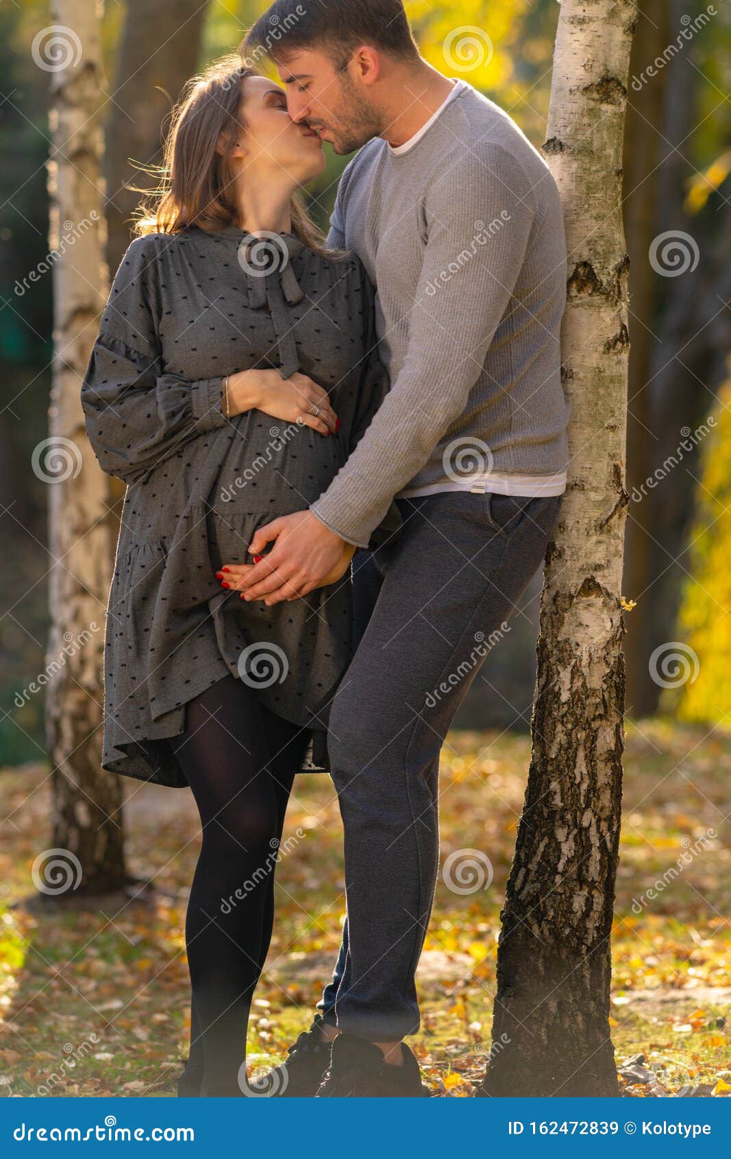 Loving Pregnant Young Couple Ki