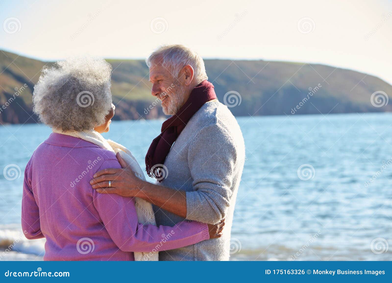 couple hugging standing on shore photo - Free Nature Image 