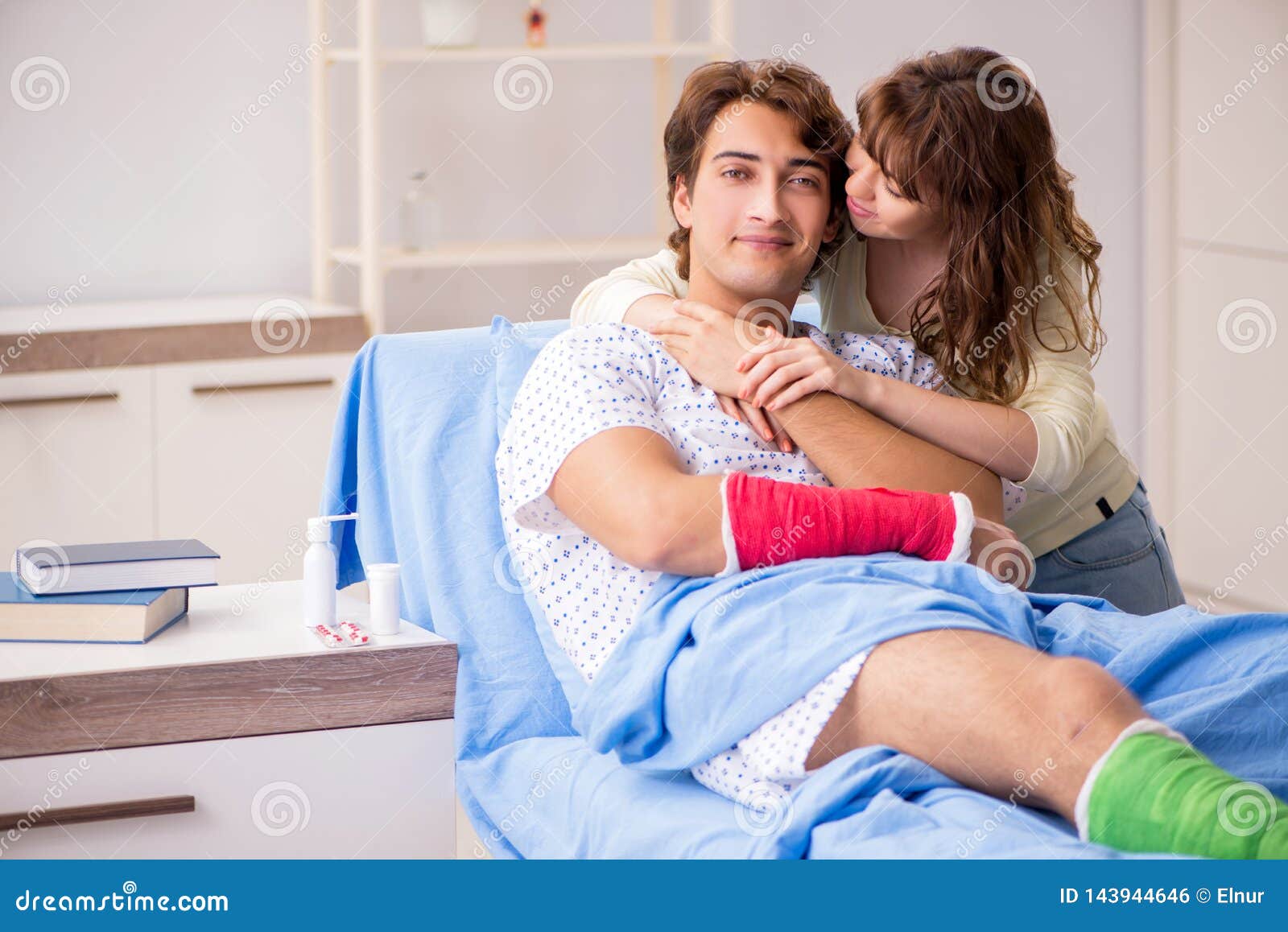 The Loving Wife Looking after Injured Husband in Hospital Stock Photo ...
