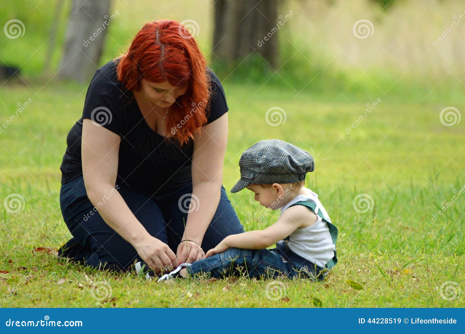 Loving Young Mother Ties Up Little Boys Son Shoe Laces Stock Image