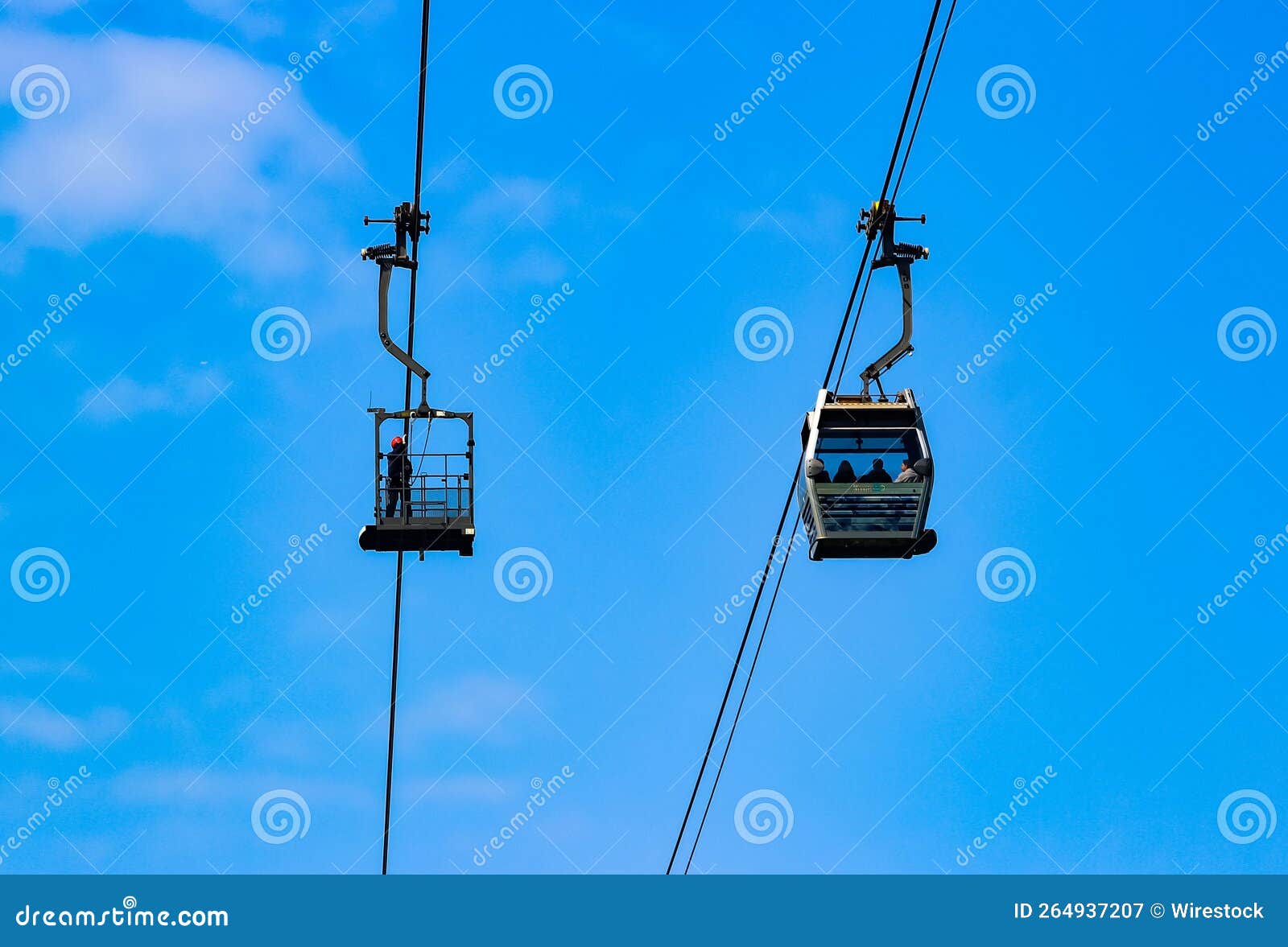 Low Angle of the Cable Cars with People Inside Watching a Landscape