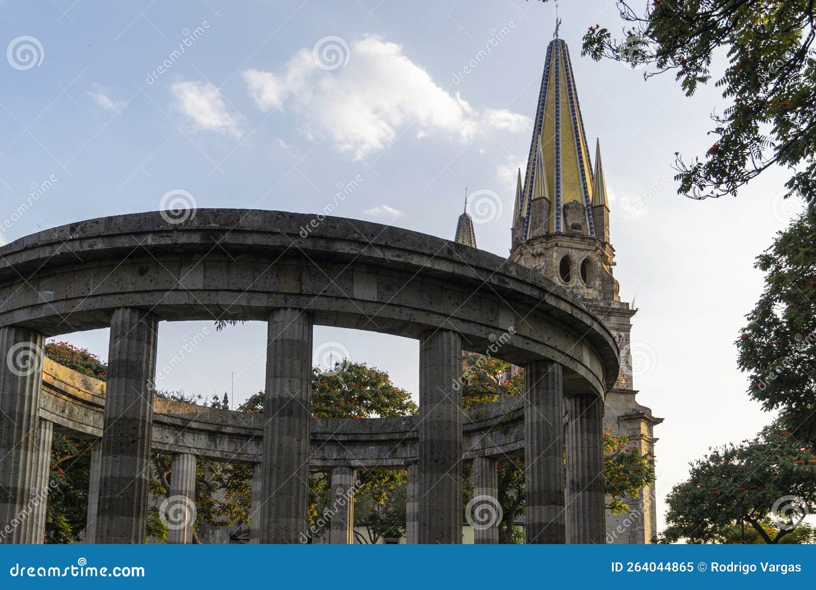 low angle perspective of part of rotonda de los jaliscienses ilustres with two towers of cathedral