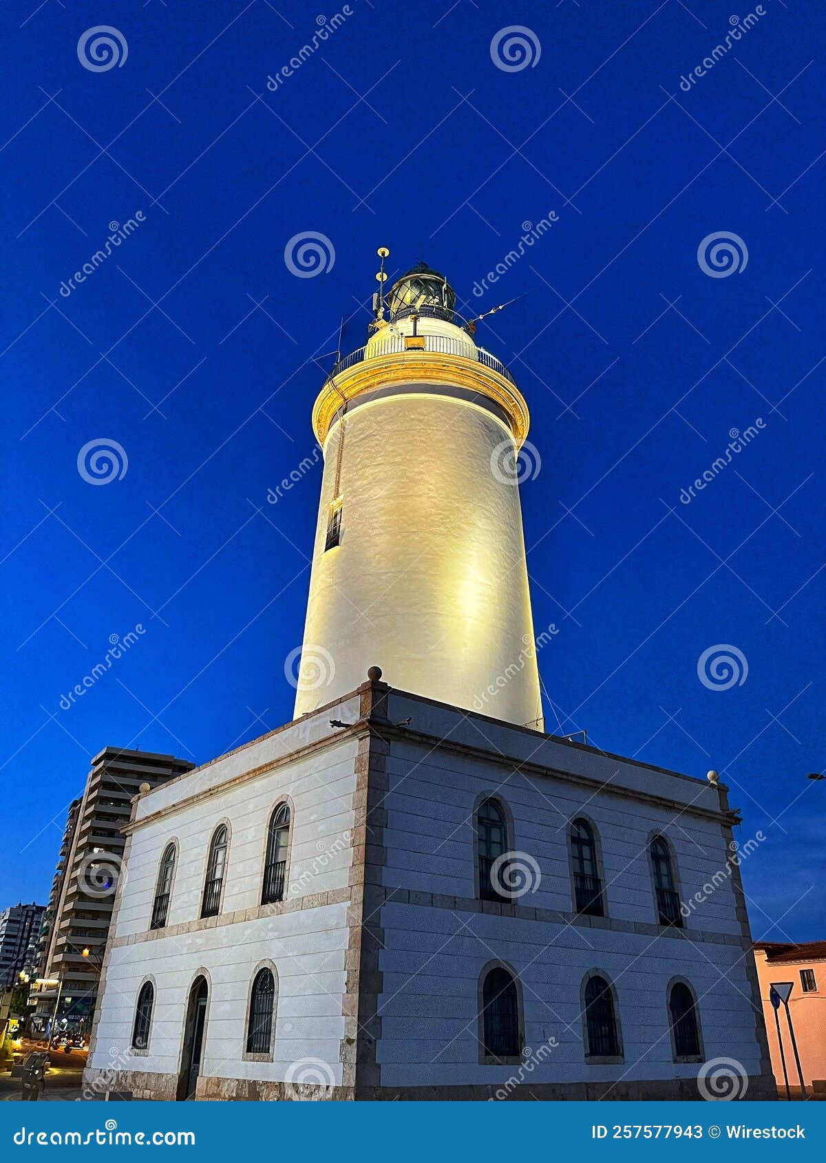 low angle shot of la farola lighthouse in malaga, spain during nighttime