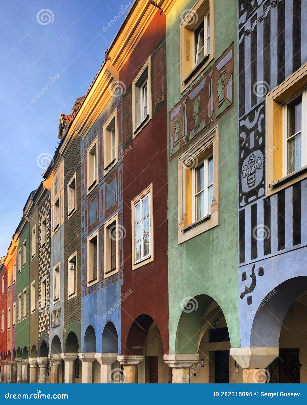 low angle view of facade of the historic houses against sky in pozna?, poland, june 2019