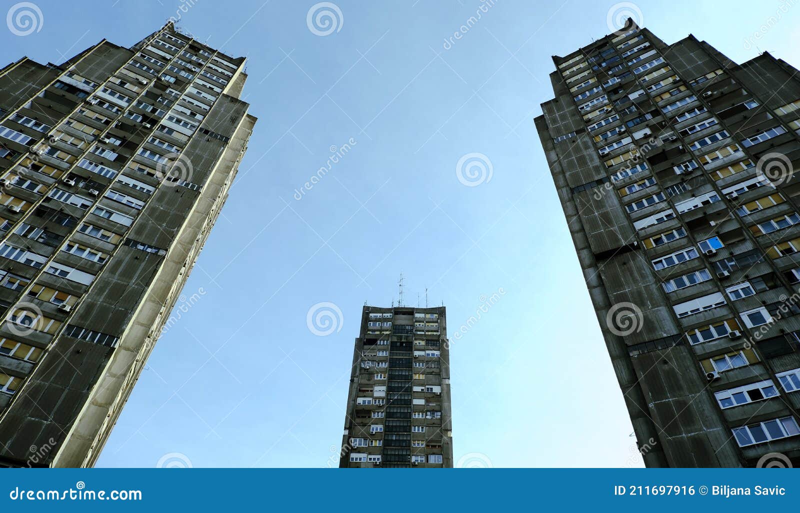 low angle view of tall three brutalist buildings in belgrade, serbia