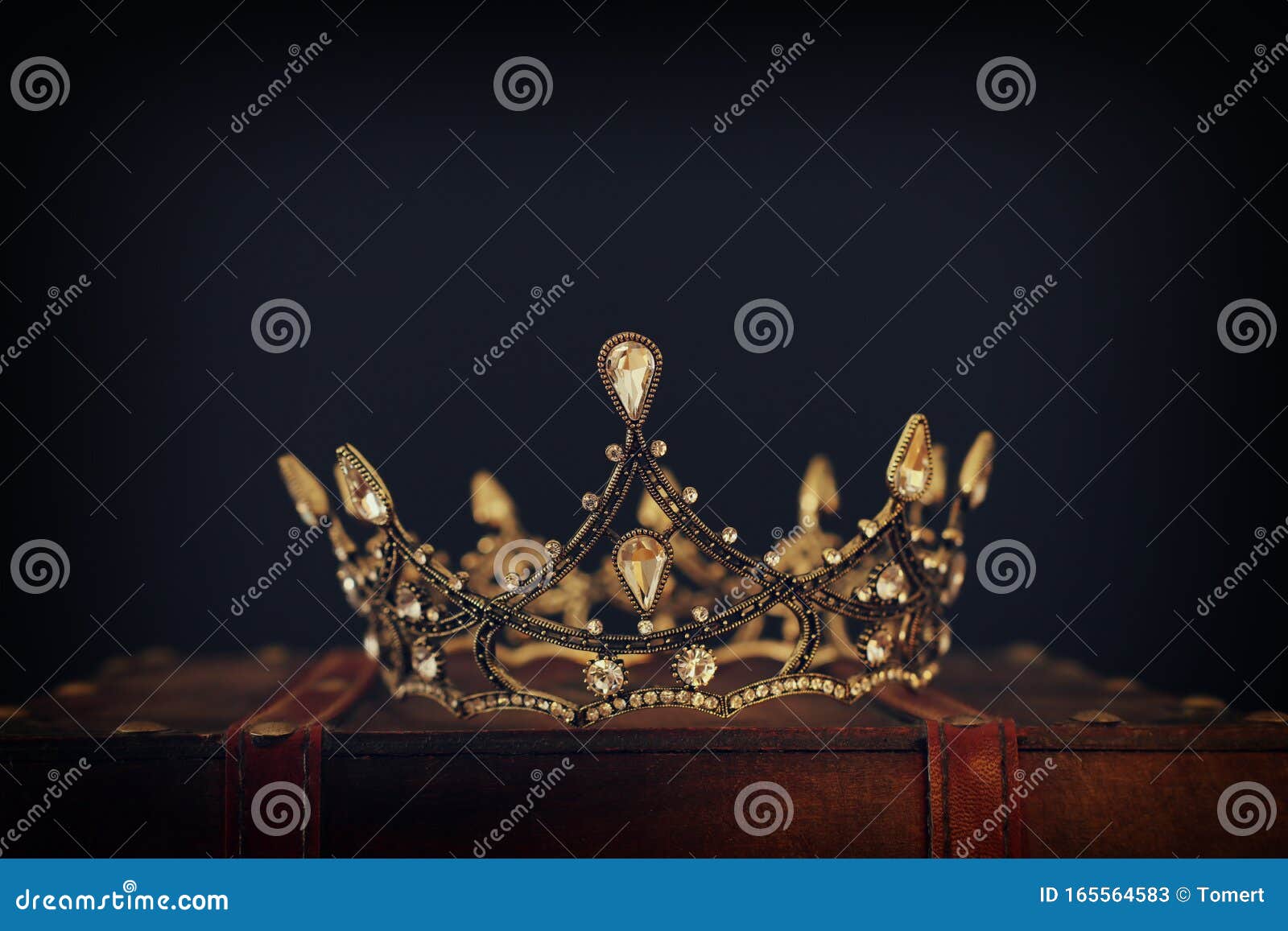 Low Key Image of Beautiful Queen/king Crown Over Wooden Table. Vintage