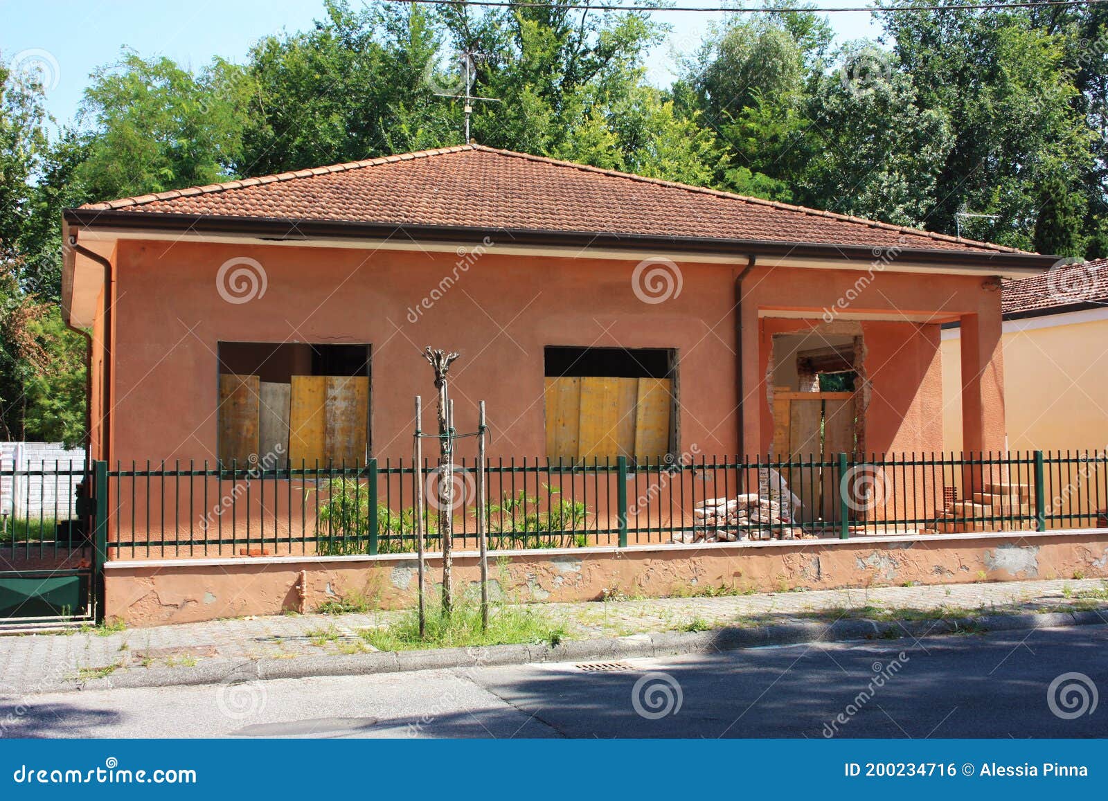 Low and Large Salmon Pink House with Renovations Stock Photo Image of
