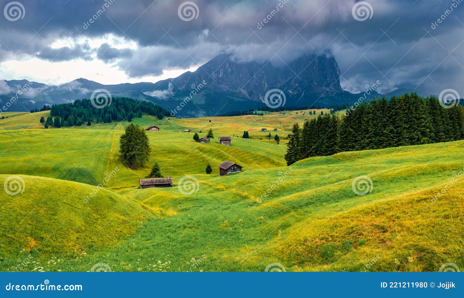 low overcast view of compaccio village with sassolungo peak,