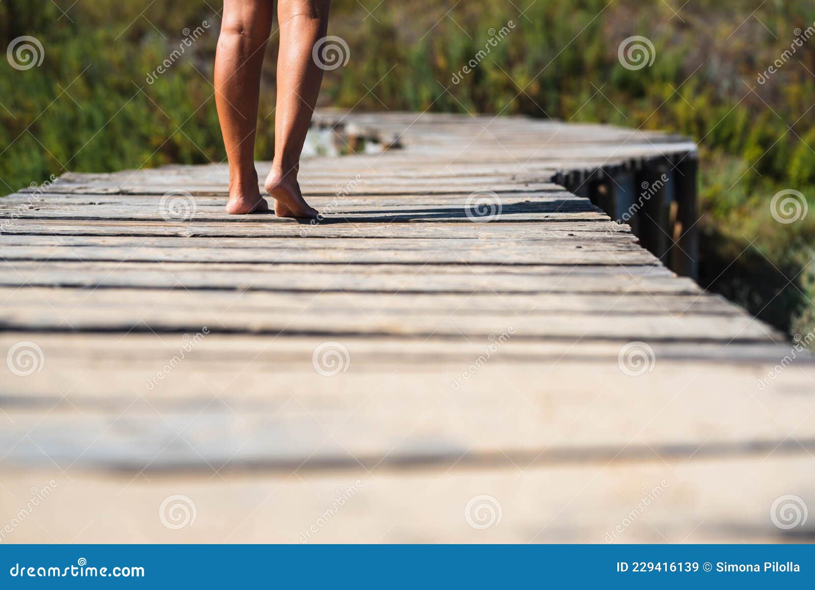 Low Section Legs of Woman Walking Barefoot on Elevated Footbridge ...