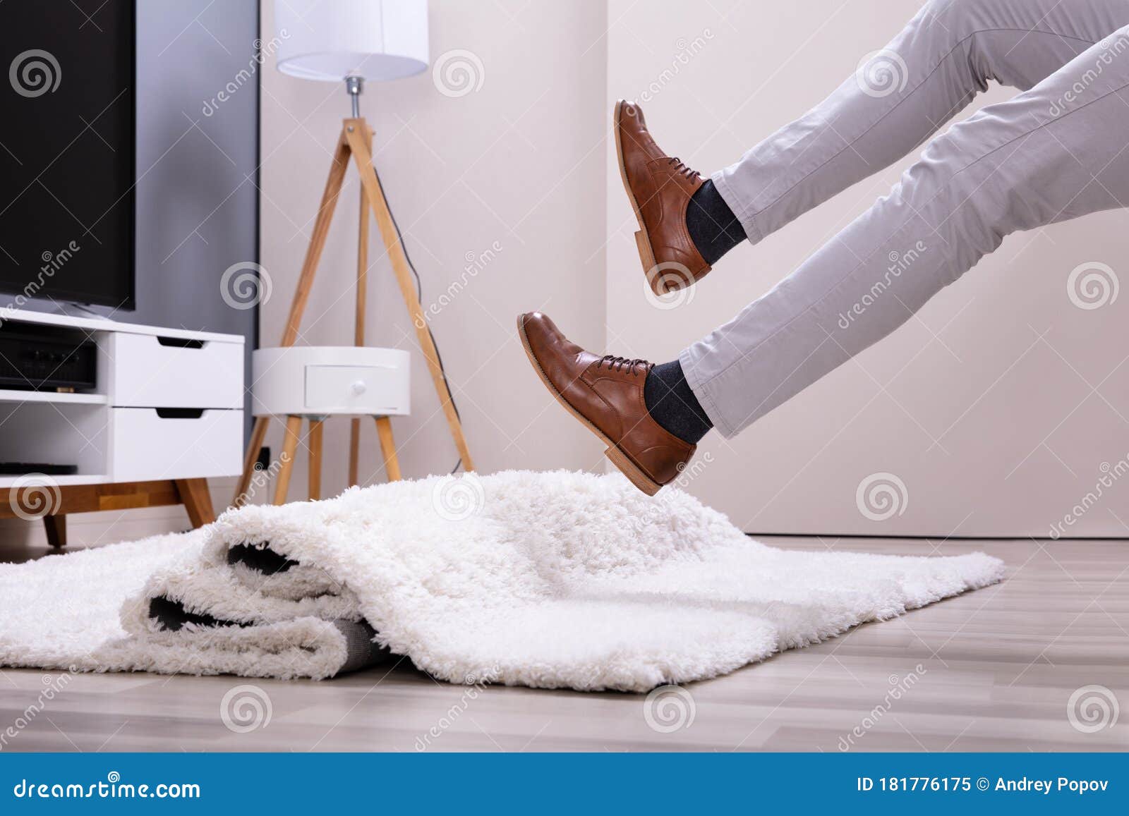 man legs stumbling with a carpet