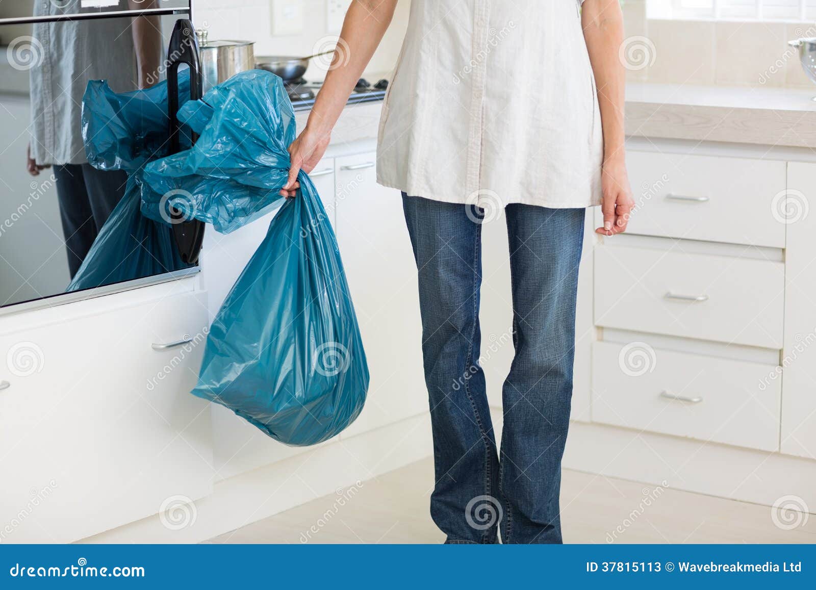 Low Section of Woman Carrying Garbage Bag in Kitchen Stock Image ...