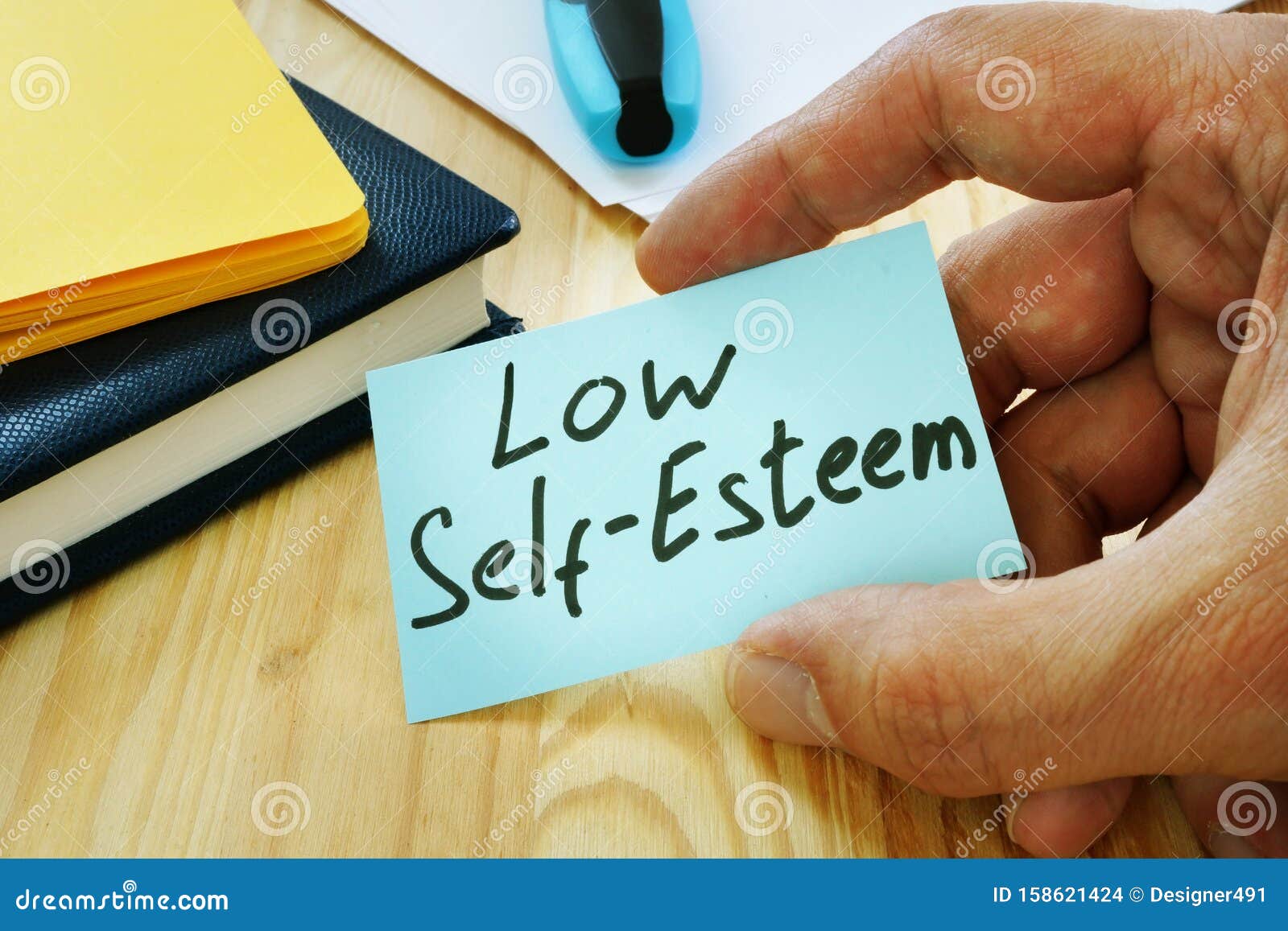 low self esteem sign in the hand