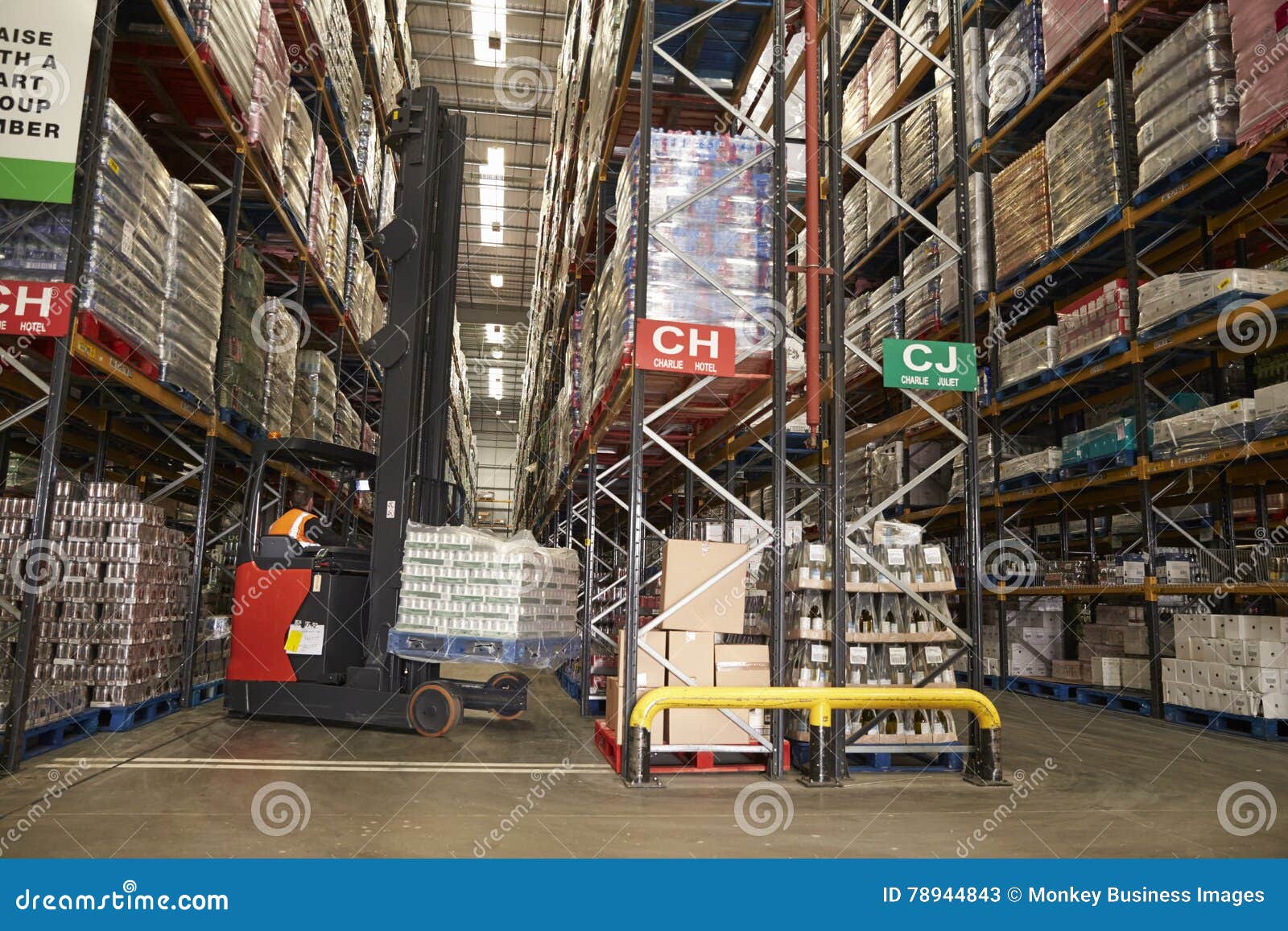lowering stock in a distribution warehouse using aisle truck
