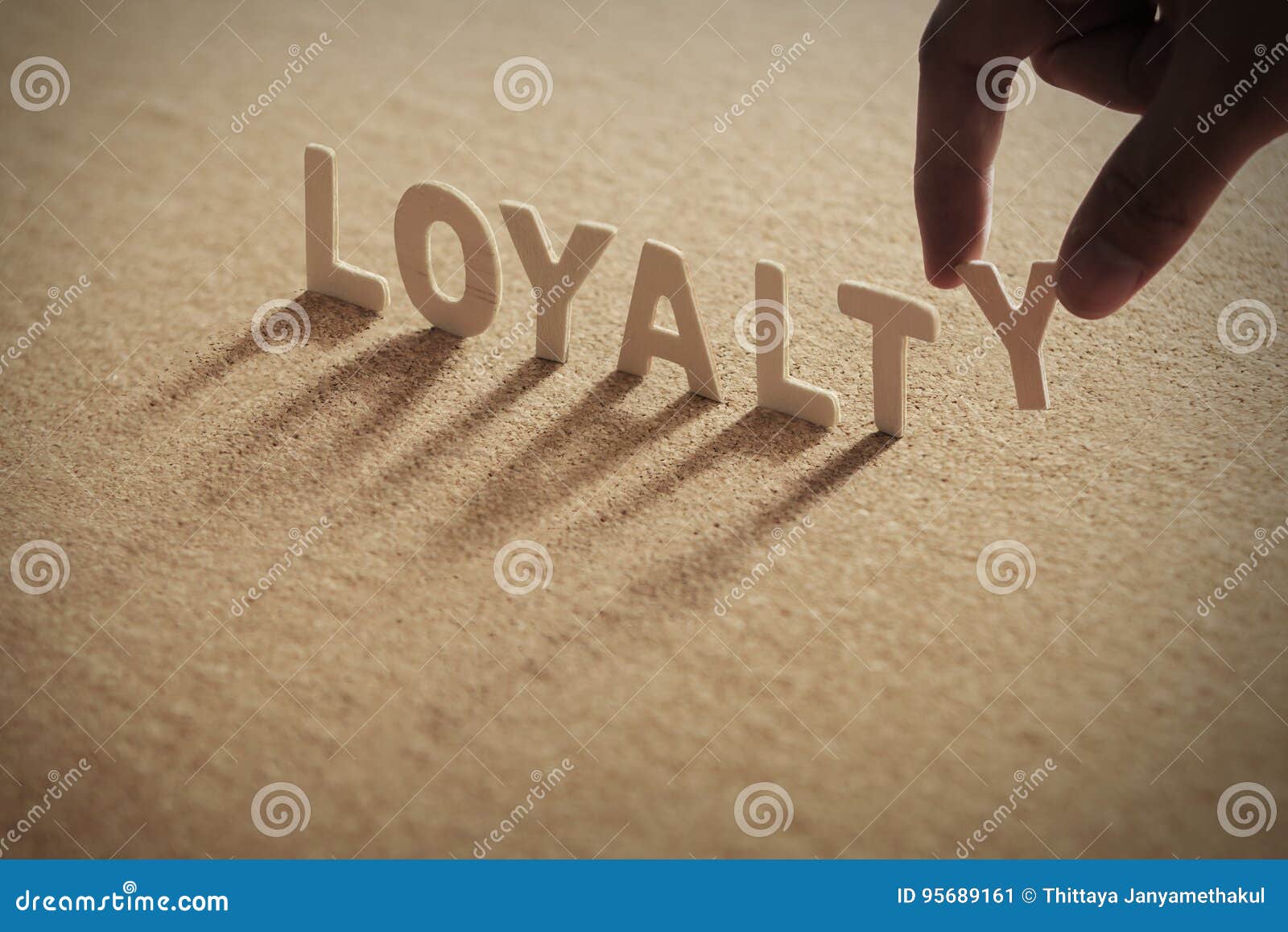 loyalty wood word on compressed board
