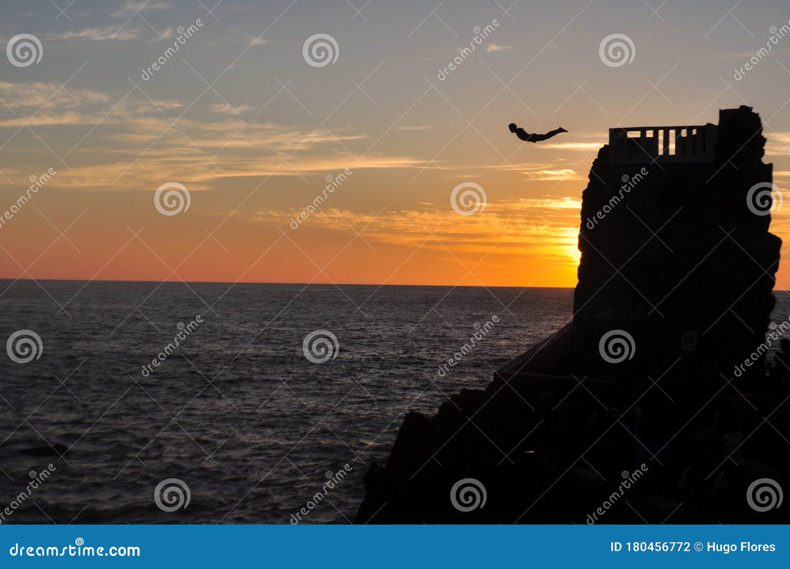 diver in flight before falling into the sea