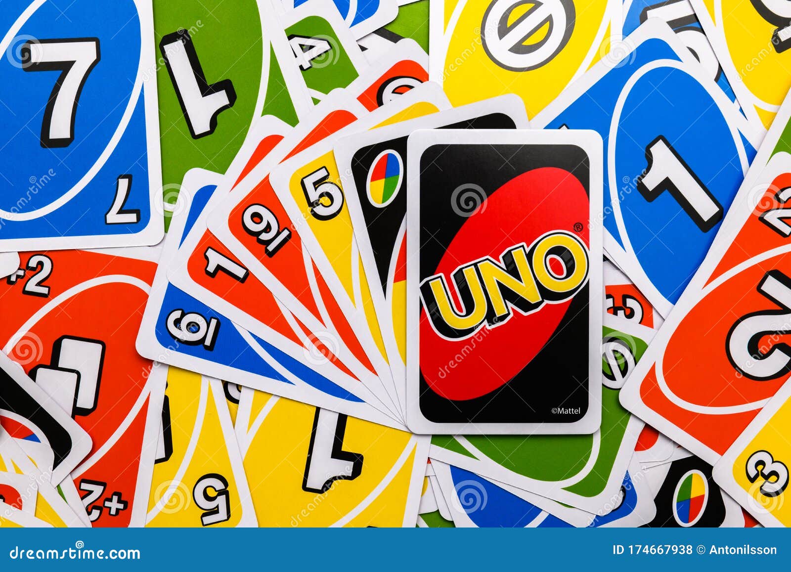 Deck of Uno Game Cards Scattered All Over on a Table. American