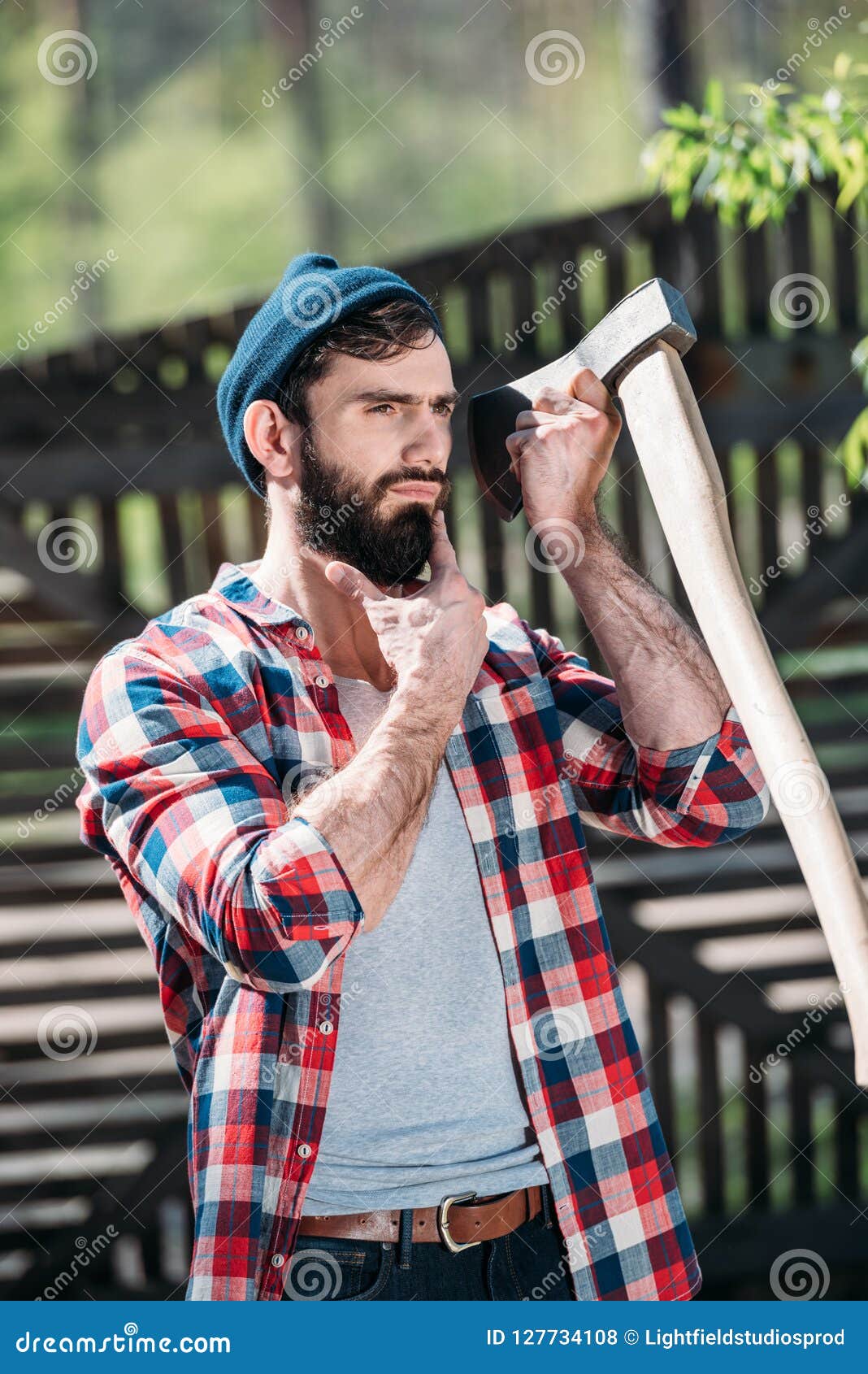 https://thumbs.dreamstime.com/z/lumberjack-checkered-shirt-shaving-beard-axe-sawmill-127734108.jpg