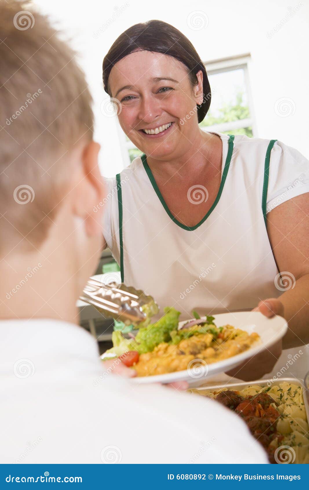 Lunchlady Serving Plate of Lunch in a School Stock Photo Image of