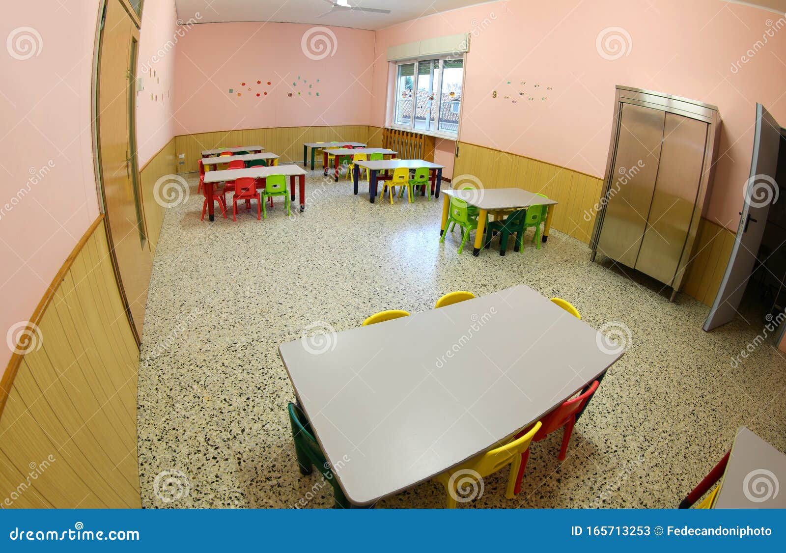 lunchroom with small chairs and tables for a school for the chil