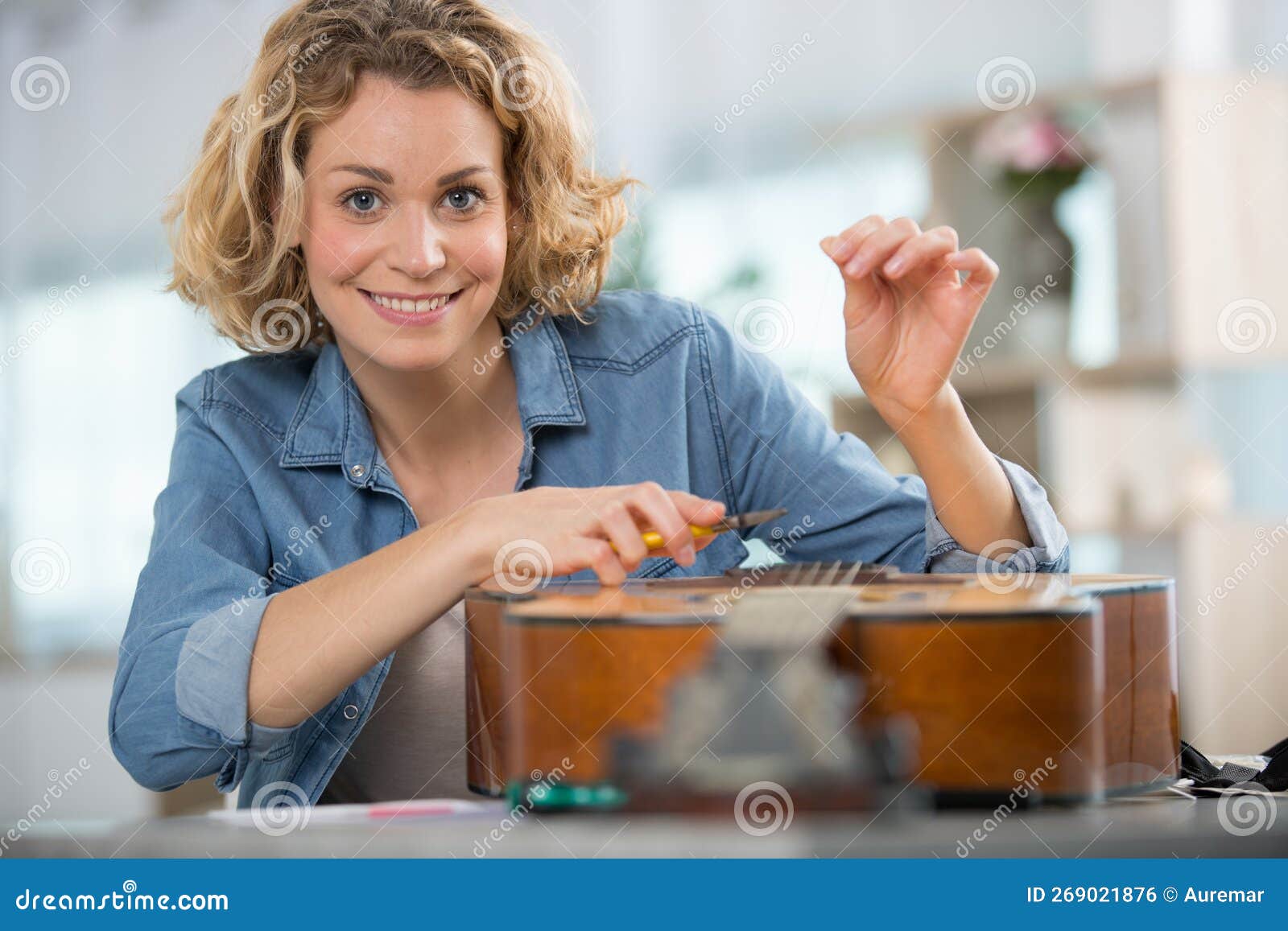 Luthier Apprentice Cleans Concert Guitar with Care Stock Photo Image